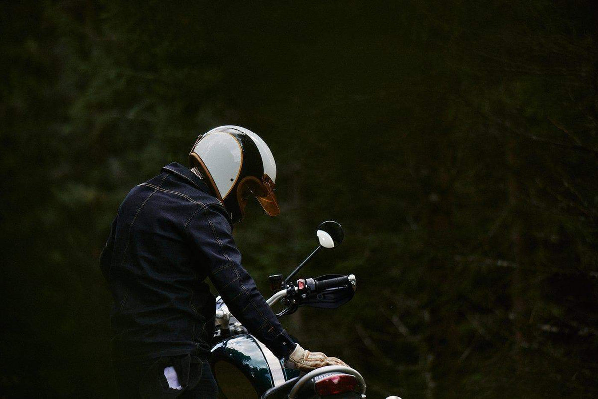 Model wearing our BSMC x Hedon Motorcycle Club Classic Helmet DOT in the forest