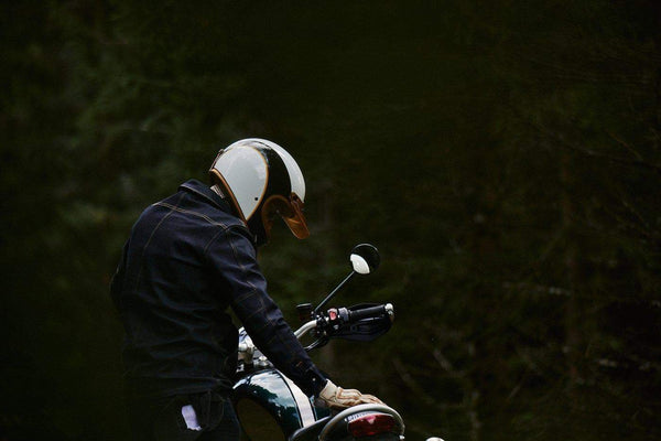 Model wearing our BSMC x Hedon Motorcycle Club Classic Helmet DOT in the forest