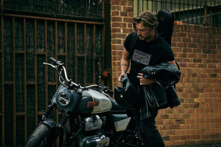 Donny gearing up to ride Dutch's Royal Enfield while wearing our BSMC x Royal Enfield Vinplate T Shirt - Black