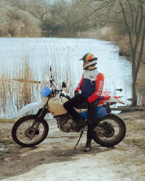 Harry wearing our BSMC XR Motorcycle Race Jersey - WHITE/BLUE/RED sitting on his dirt bike