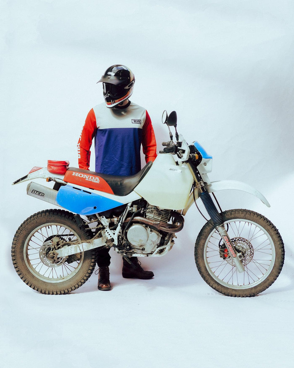 Harry wearing our BSMC XR Motorcycle Race Jersey - WHITE/BLUE/RED on a white back drop