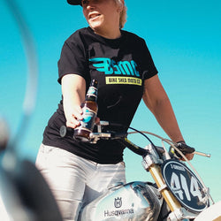 Model wearing our BSMC XT T Shirt - Black standing on a bike