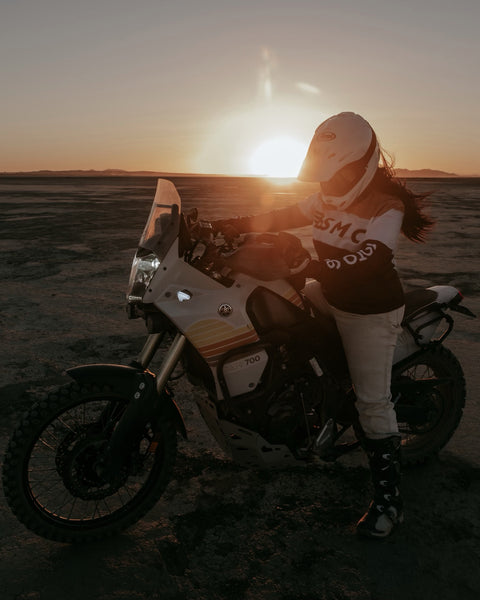 Caro sitting on her Tenere wearing our Motorcycle Wing Race Jersey - Gold