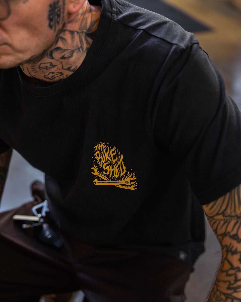 Model wearing our BSMC Speed Demon Graphic T-Shirt - Washed Black, logo close up